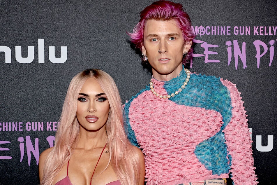 Doting dad Machine Gun Kelly (r.) has opened up about why he and Megan Fox chose to name their baby girl Saga Blade.