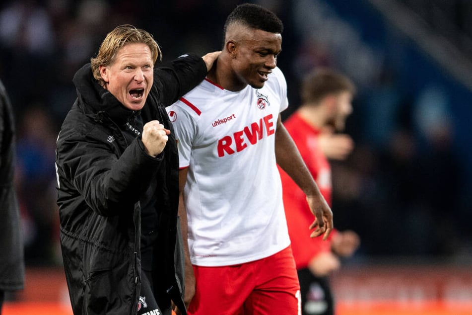 Kölns Trainer Markus Gisdol (l) und Jhon Cordoba jubeln.