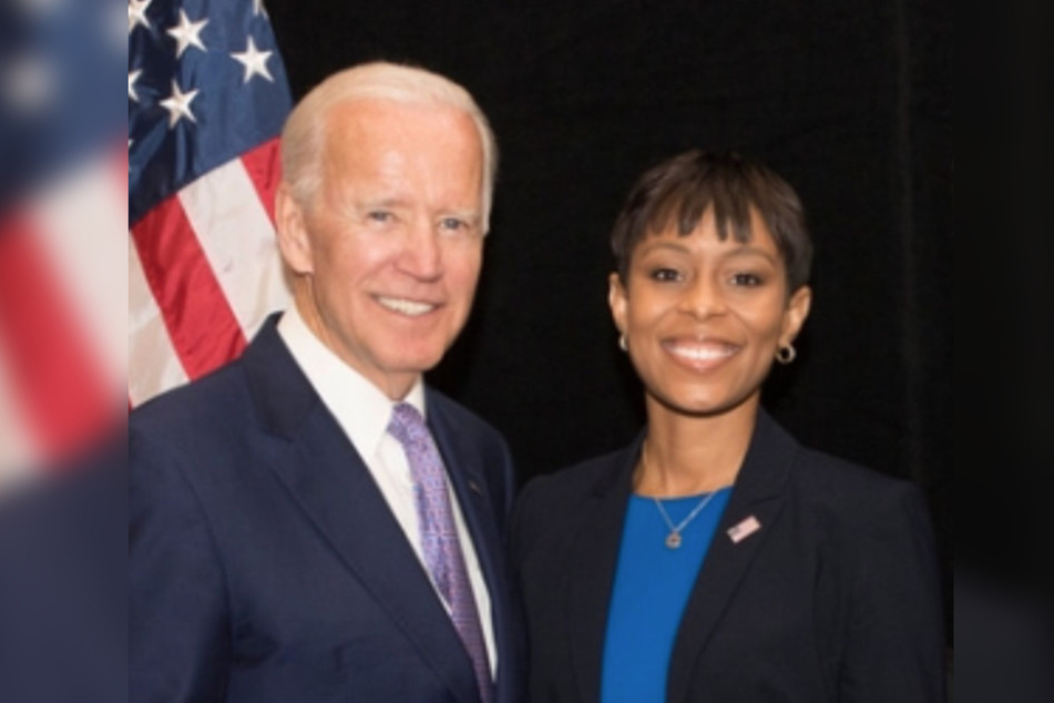 Shontel Brown (r.) poses with Joe Biden during his second trip to Ohio as president.