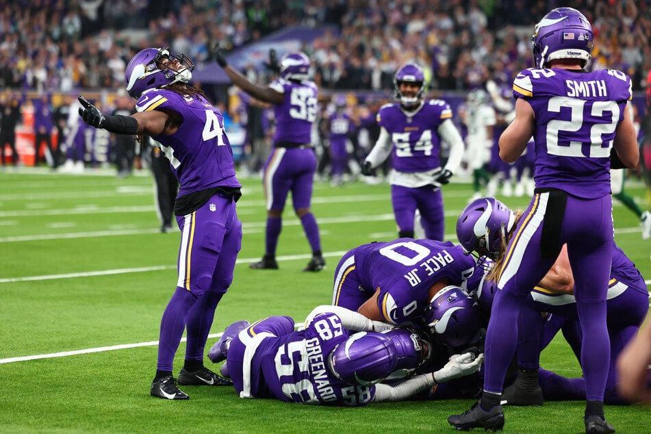 Minnesota Vikings defensive back Josh Metellus celebrates the interception from defensive back Stephon Gilmore in the fourth quarter against New York Jets at Tottenham Hotspur Stadium.