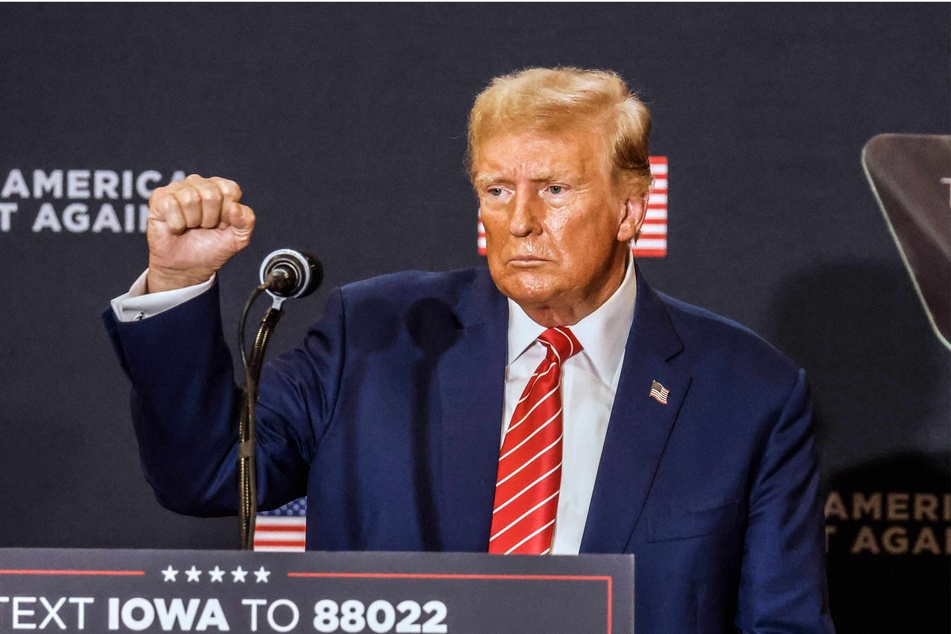 Former president Donald Trump speaking at a Commit to Caucus rally in Clinton, Iowa, on Saturday night.