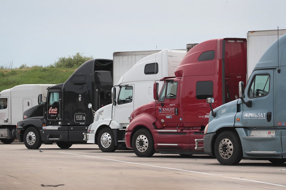 Semi trucks sit at a highway oasis along I94 near Lake forest, Illinois.