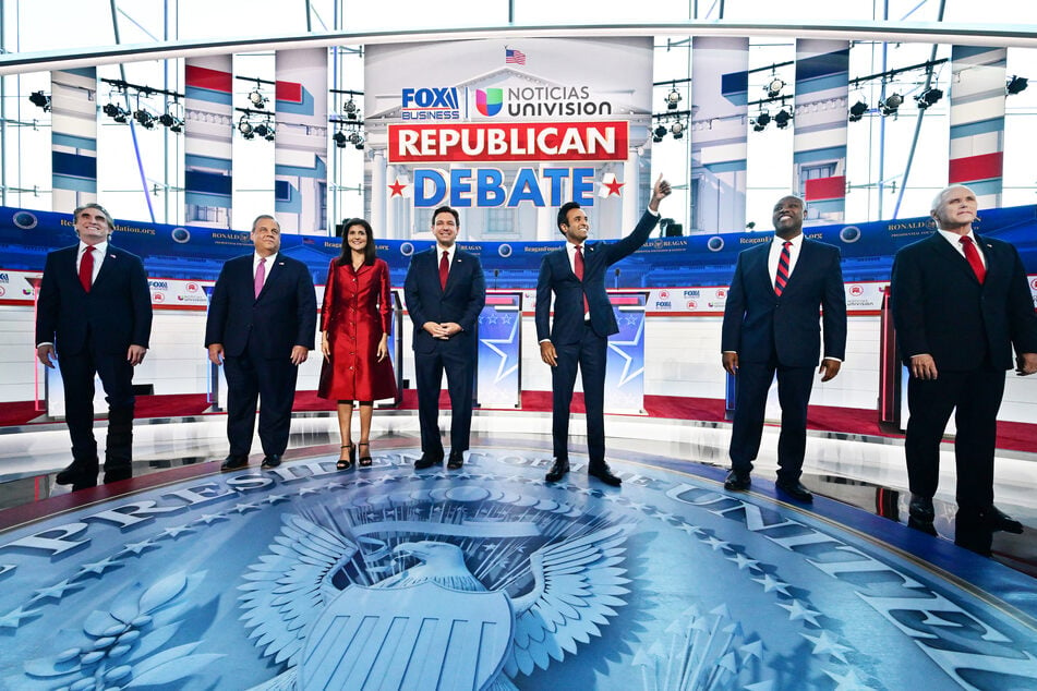 From l. to r.: Doug Burgum, Chris Christie, Nikki Haley, Ron DeSantis, Vivek Ramaswamy, Tim Scott, and Mike Pence ahead of the second GOP primary debate.