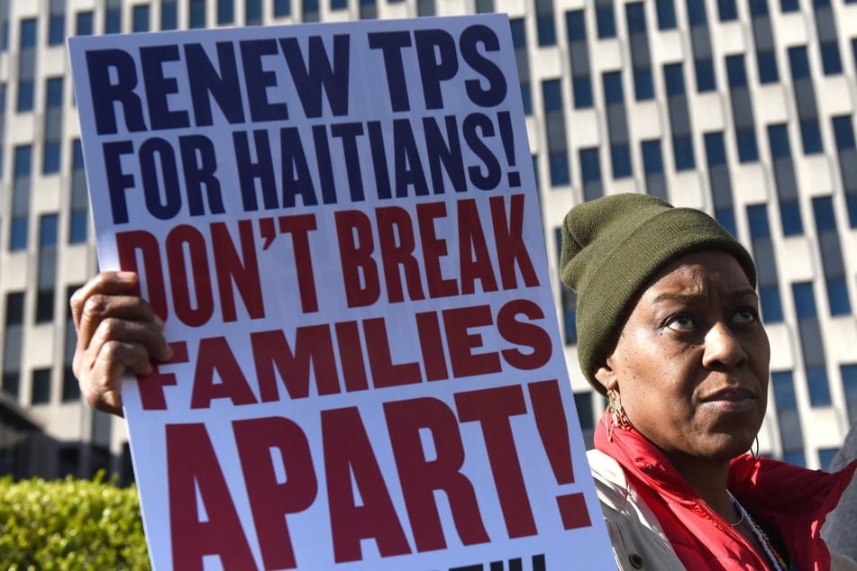 Immigrants' rights advocates rally against a DHS decision to terminate TPS for Haitians in New York City on November 21, 2017.