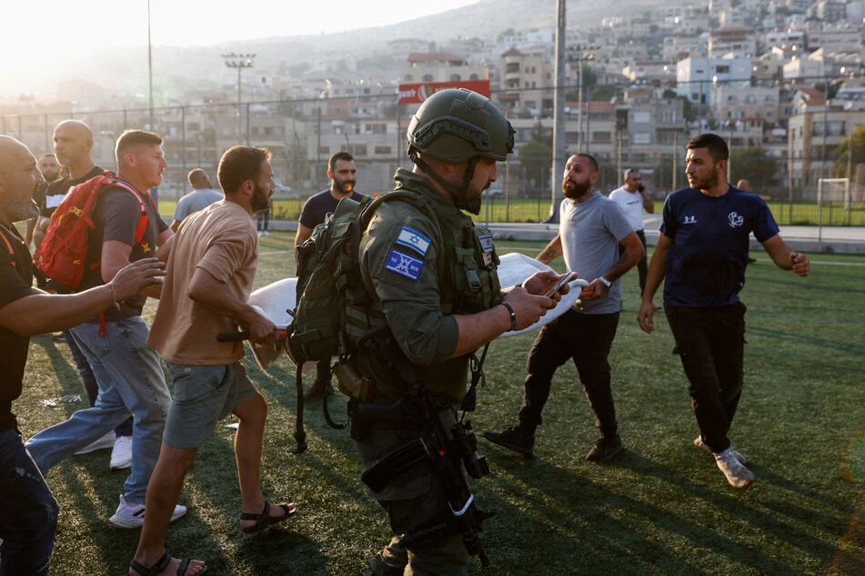 A rocket fired from Lebanon hit a soccer field in an Arab town in the Israeli-annexed Golan Heights Saturday, killing 11 youngsters.