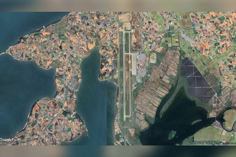 The satellite image from Google Earth shows Muan Airport.