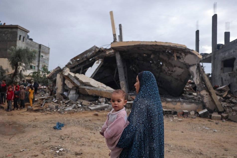 Palestinians inspect the destruction following overnight Israeli strikes on Rafah in the southern Gaza Strip on May 6, 2024.