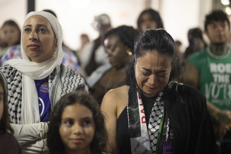 Supporters wearing Palestinian keffiyehs react as Congresswoman Cori Bush delivers her primary election concession speech in St. Louis, Missouri, on August 6, 2024.