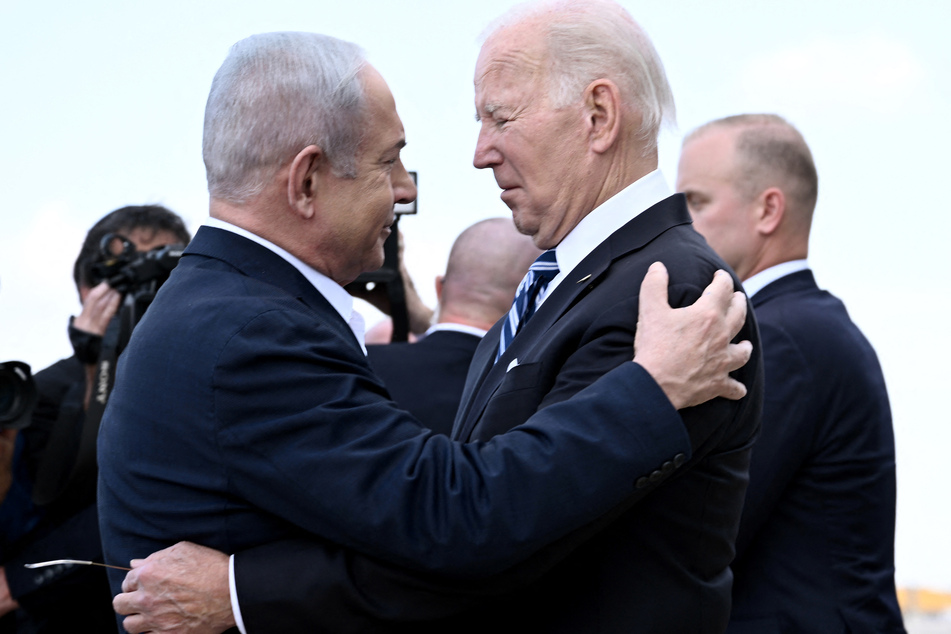 Israel Prime Minister Benjamin Netanyahu (l.) greets US President Joe Biden upon his arrival at Tel Aviv's Ben Gurion airport on October 18, 2023.