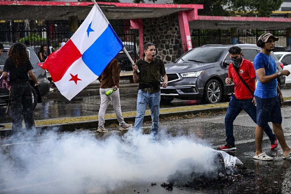 A demonstrator waves a Panamanian flag during a protest against the visit of the US Secretary of State Marco Rubio in Panama City, on January 31, 2025.