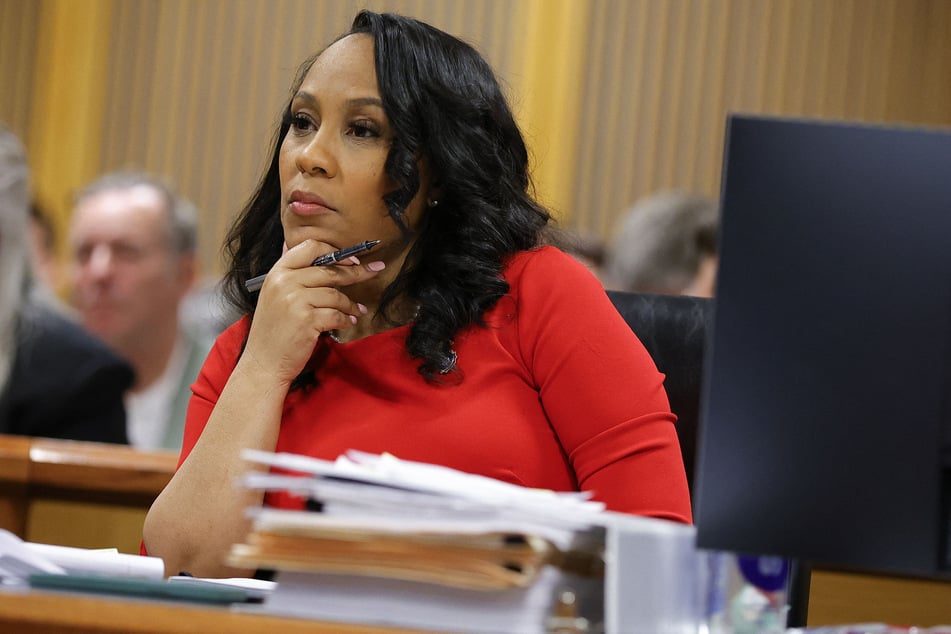Fulton County District Attorney Fani Willis listens during the final arguments in her disqualification hearing at the Fulton County Courthouse on March 1, 2024, in Atlanta, Georgia.