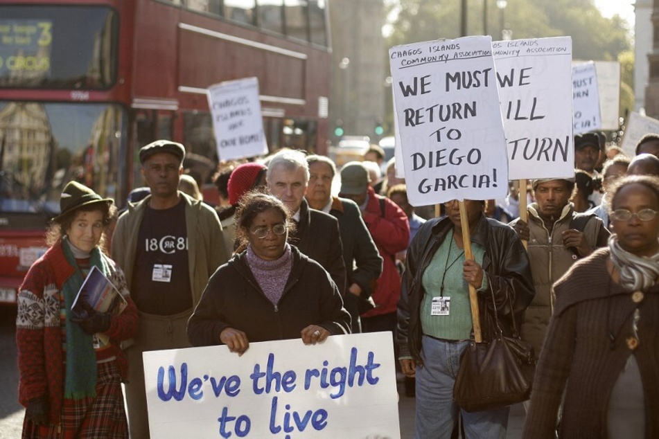 Chagossians protest for their right to return to the Chagos Islands in front of the UK Houses of Parliament in London.