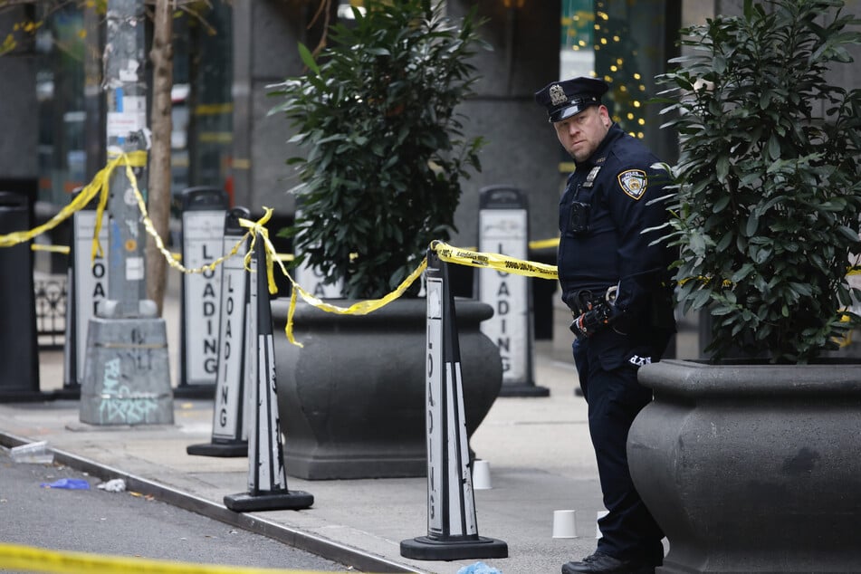 A police officer at the crime scene: 58th Street in Manhattan.