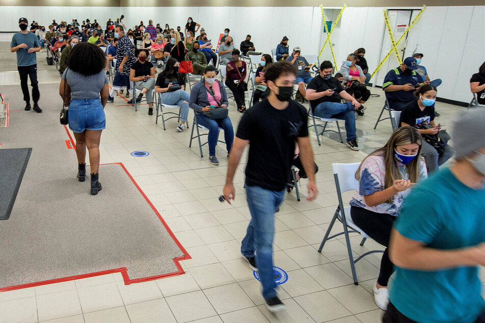 The waiting area of a vaccination site in Riverside, California, is packed. However, two shots might not be enough..