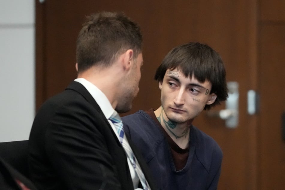 Robert E. Crimo III (r.) speaks to Lake County's assistant public defender Anton Trizna (l.) as he appears for a hearing before Judge Victoria A. Rossetti at the Lake County Courthouse on June 26, 2024 in Waukegan, Illinois.