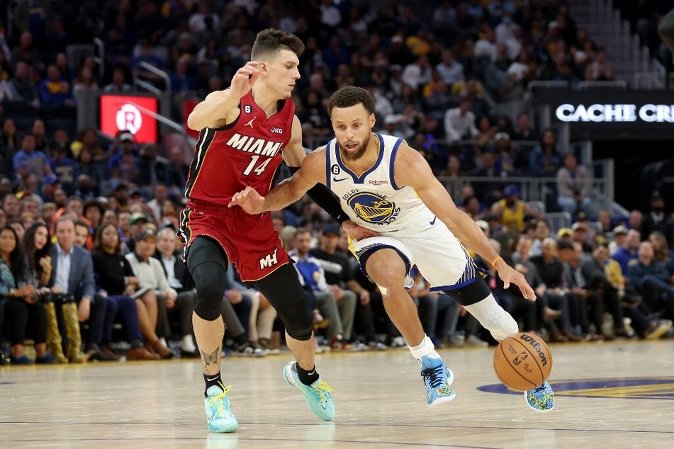 On Thursday night, NBA veteran Stephen Curry (r) took fourth-year Heat star Tyler Herro (l) by surprise after a wild crossover had Herro lost in space.