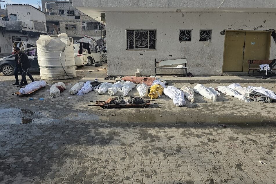 The bodies of victims lie in the courtyard of the Kamal Adwan hospital in Beit Lahia in the northern Gaza Strip, following Israeli strikes around the medical complex on December 6, 2024.