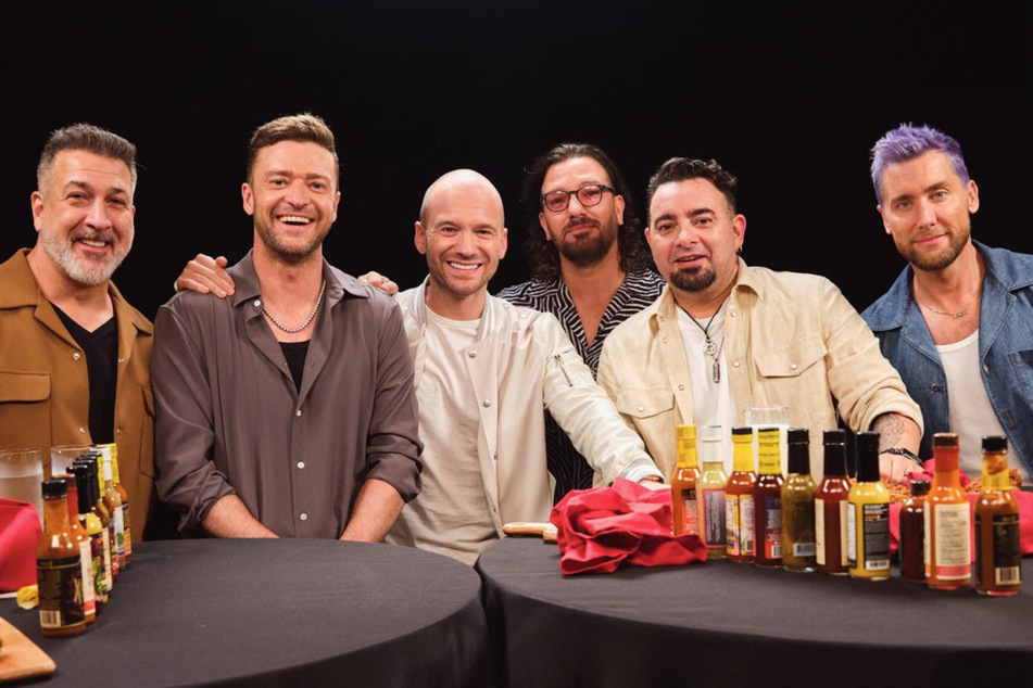 *NSYNC gets spicy and sweaty in fire Hot Ones stint