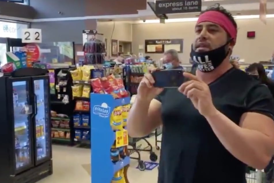 One protester said he didn't need to wear a mask because he tested negative, and calls another shopper a "mask Nazi."