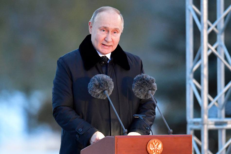 Russia's President Vladimir Putin delivers a speech during the opening ceremony of a monument to civilians killed during World War Two, near the village of Zaitsevo, Leningrad region, on January 27.