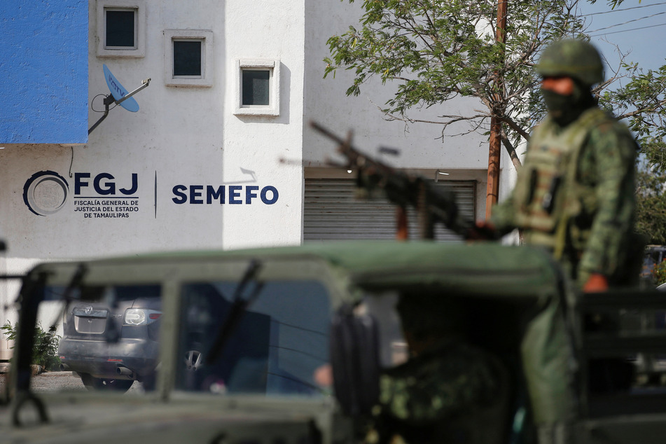 Soldiers stand guard outside the Forensic Medical Service morgue building in Matamoros, Mexico, after authorities found the bodies of two of four Americans kidnapped by gunmen.