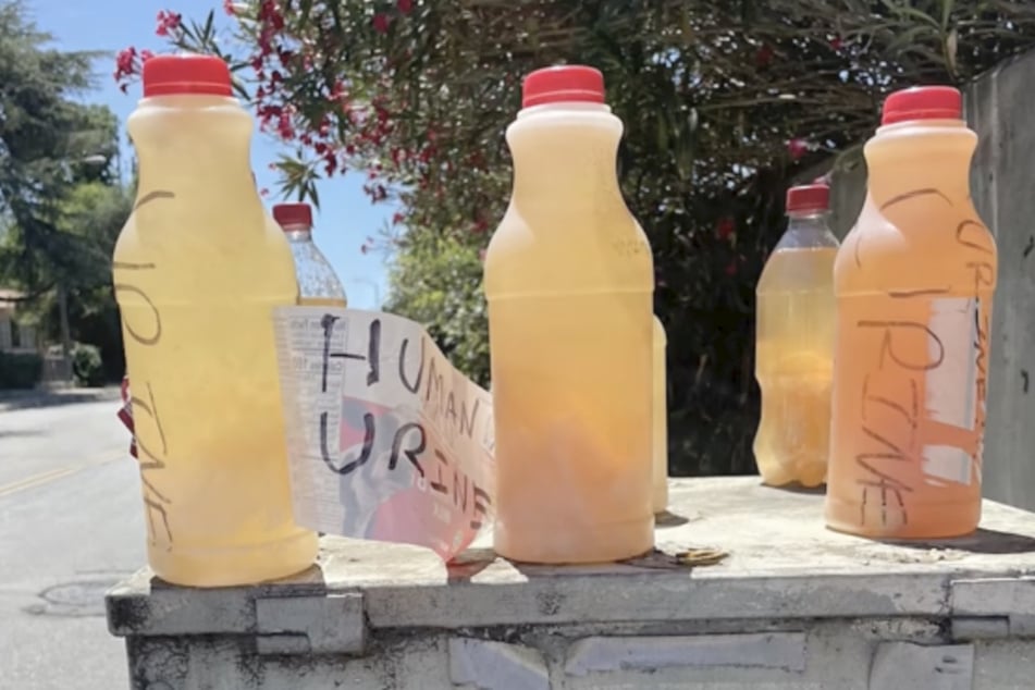 The stranger even labels the bottles filled with urine, leaving messages such as "HIV-positive" or decorating them with smiley faces.