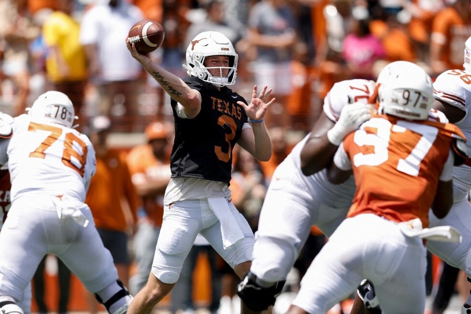 Texas' starting quarterback Quinn Ewers (c.) ranks at No. 60 on the NIL 100's top valuation, ranking in an estimate of $701,000 in NIL deals.