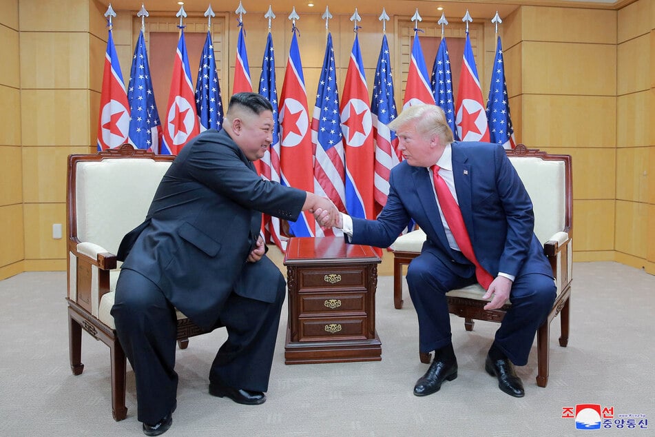 US President Donald Trump (r.) and North Korean leader Kim Jong Un shake hands during a meeting at the demilitarized zone separating the two Koreas on June 30, 2019.