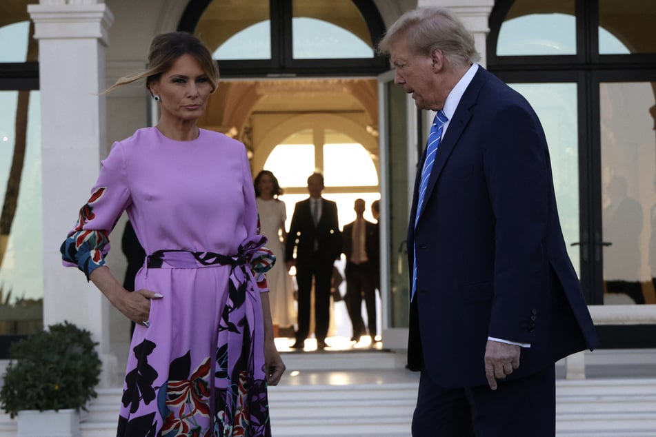 Republican presidential candidate, former US President Donald Trump (r.) and former First Lady Melania Trump (l.) arrive looking morose for a much-scrutinized campaign appearance on April 6, 2024 in Palm Beach, Florida.