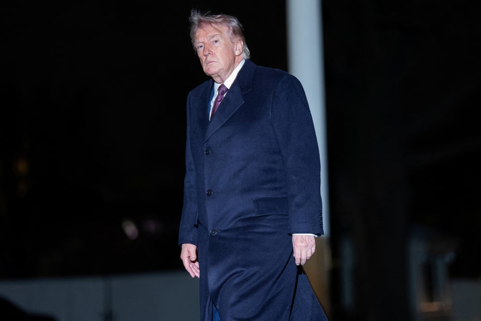 President Donald Trump walks as he arrives back at the White House in Washington DC on March 15, 2026.