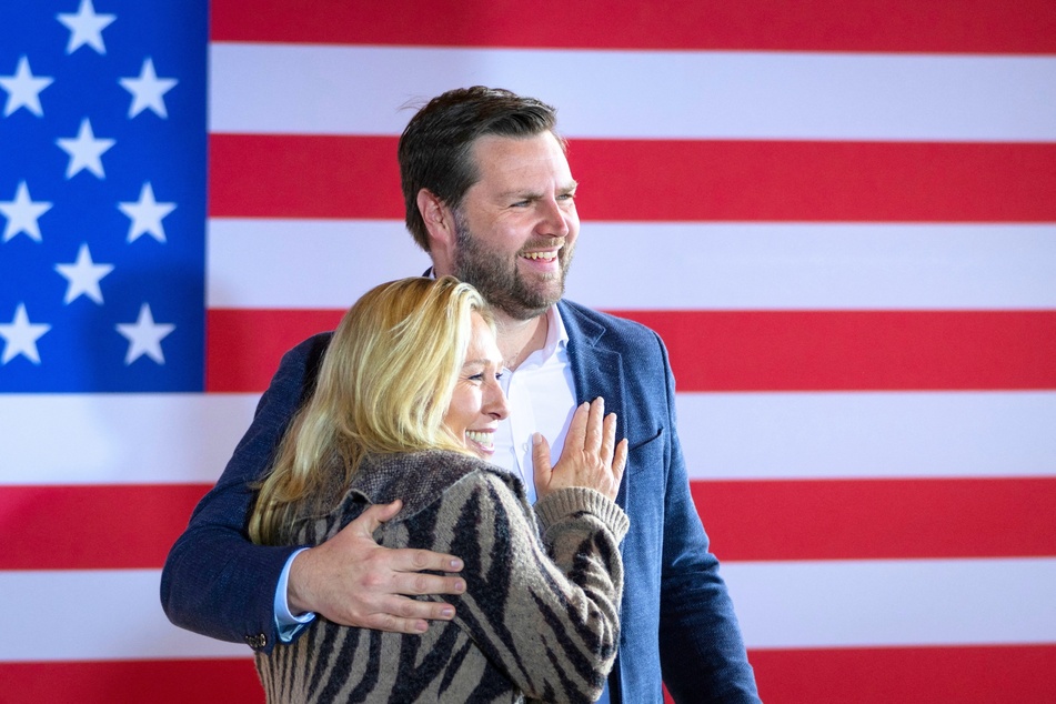 Ohio Senator JD Vance (r.) sharing a hug with Georgia Congresswoman Marjorie Taylor Greene during a rally in Newark, Ohio on April 30, 2022.