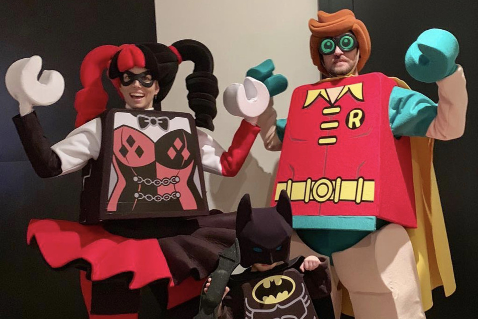 Jessica Biel (l) and Justin Timberlake (r) had family fun with their son, Silas (m) as characters from The Lego Batman Movie.