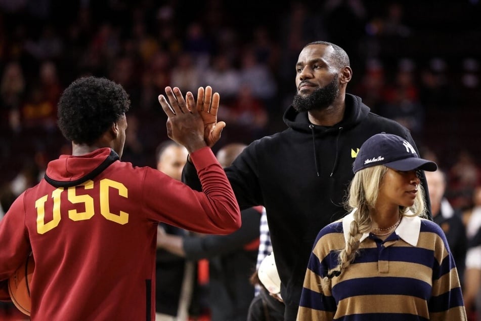 Fans and expert analysts are criticizing LeBron James for the media attention surrounding his son, Bronny James (l.).