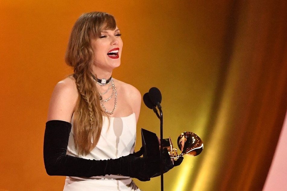 Taylor Swift accepts the Best Pop Vocal Album award for Midnights on stage during the 66th Annual Grammy Awards.