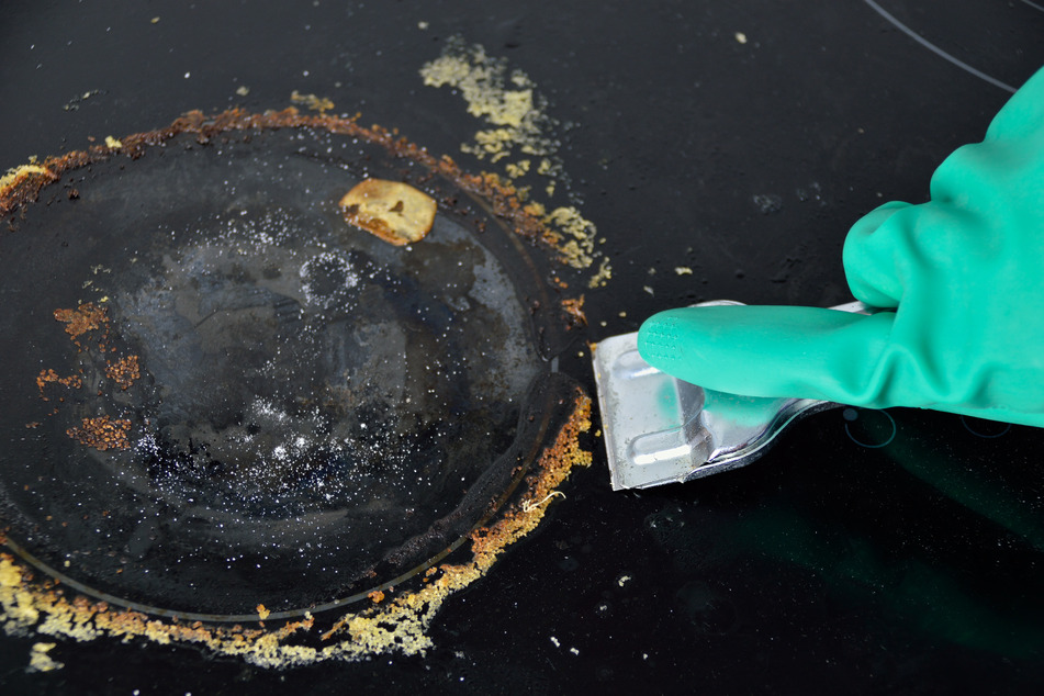 Use specialty stove top scrapers to remove coarse burnt-on dirt.