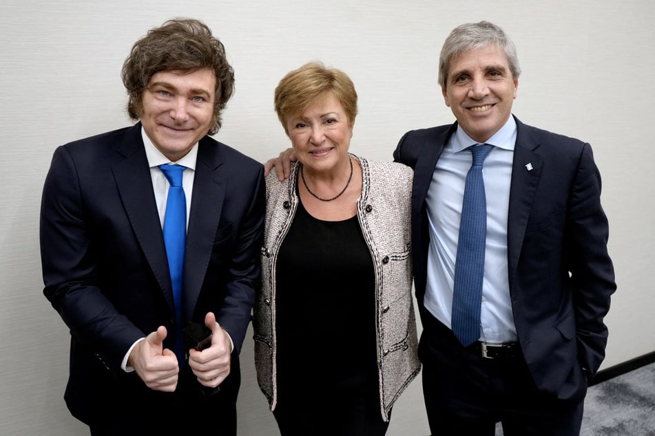 Argentina's President Javier Milei (l.) and his Economy Minister Luis Caputo (r.) pose for a picture with the Managing Director of the International Monetary Fund Kristalina Georgieva on the sidelines of the UN General Assembly in New York City on September 24, 2025.