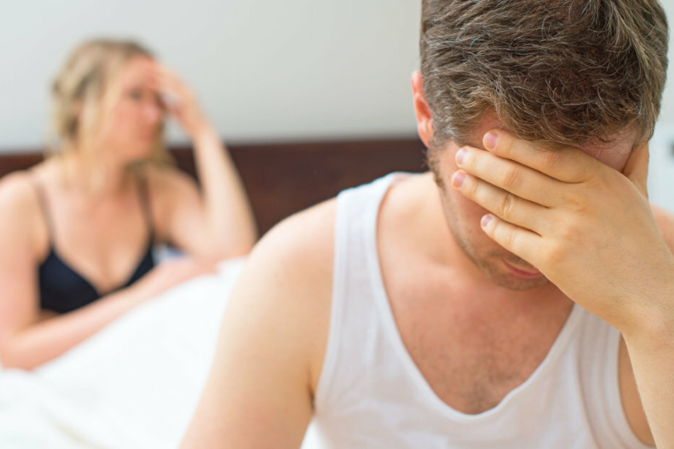 No touching! Wife refuses to let her husband come close and says it's because of the pandemic (stock image).