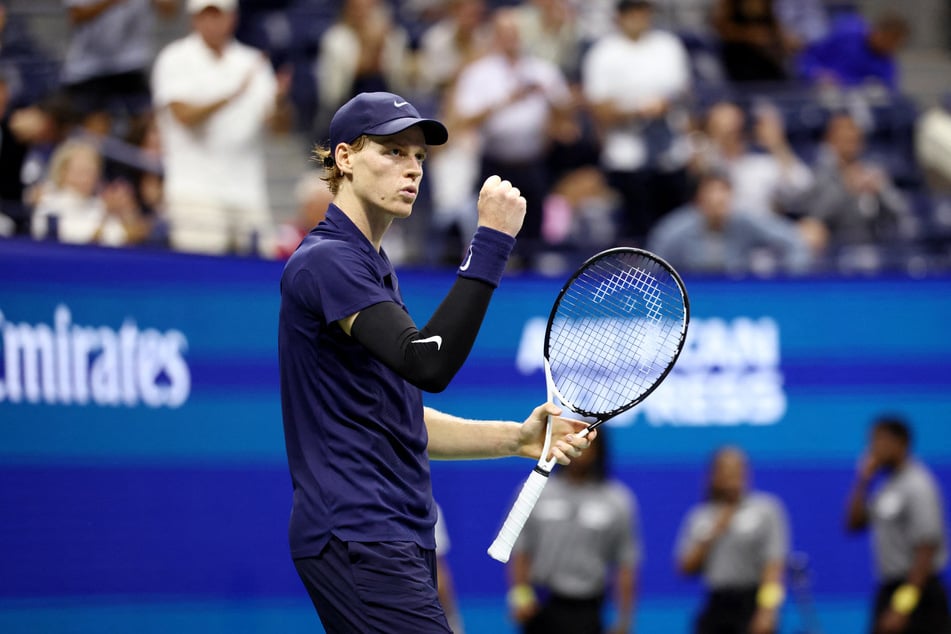 Italy's Jannik Sinner celebrates winning his men's singles semifinal match against Canada's Felix Auger-Aliassime at the 2025 US Open.