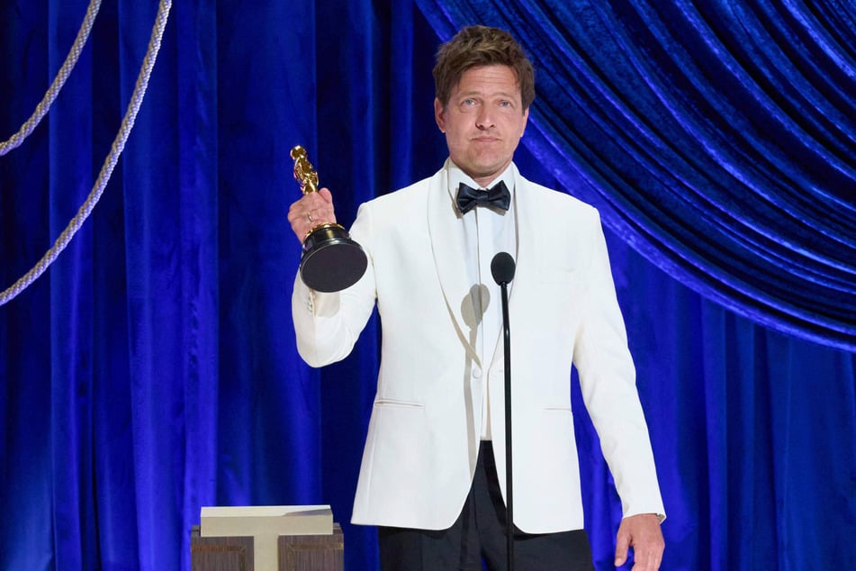 Thomas Vinterberg (51), Danish film director, stands with the Oscar for Best International Feature Film for Another Round at Union Station.