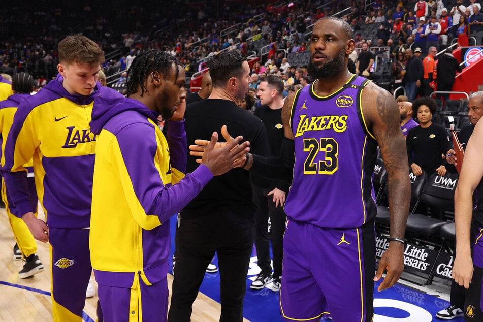 LeBron James and Bronny James (l.) became the first-ever father-son duo to play together in an NBA regular-season game.