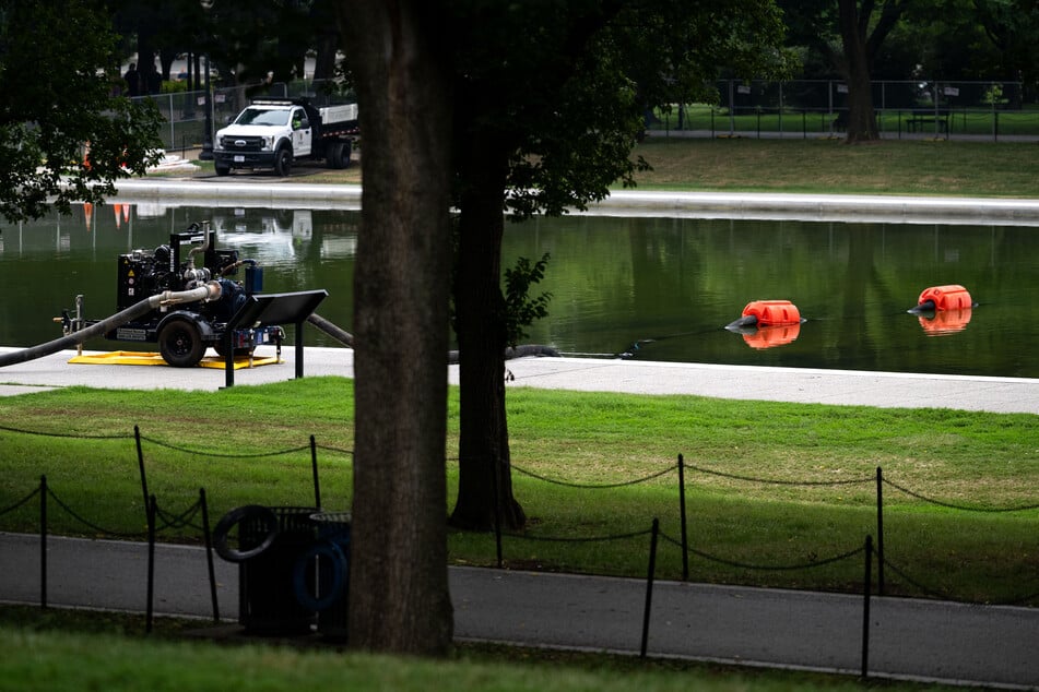 A vacuum-assisted pump is seen adjacent to the Lincoln Memorial Reflecting Pool on the National Mall in Washington DC on July 10, 2026.