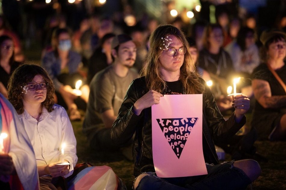People attend a candlelight vigil in Tulsa, Oklahoma, for 16-year-old non-binary student Nex Benedict, whose death has been ruled a suicide.