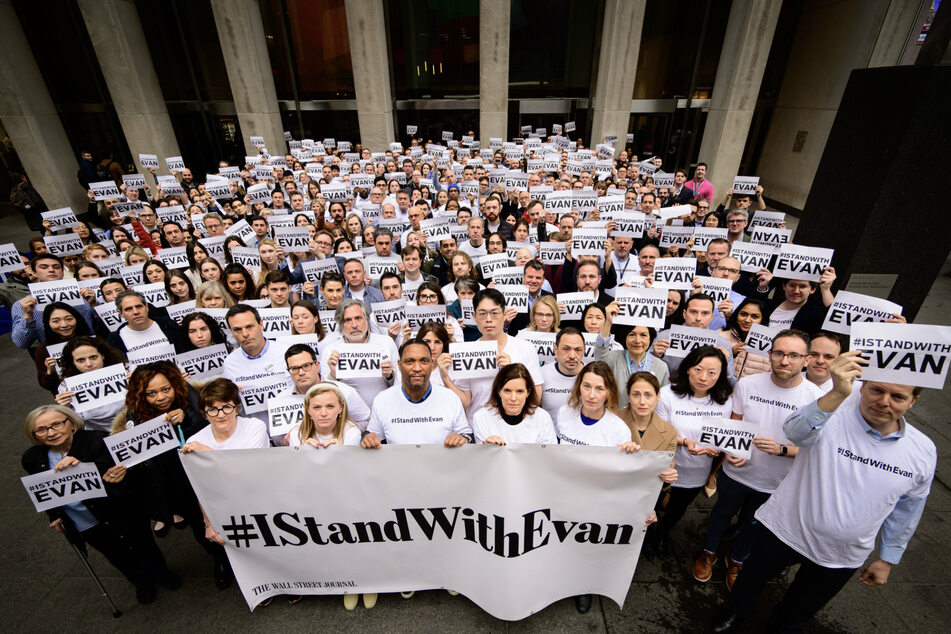 Wall Street Journal workers stand in solidarity with co-worker Evan Gershkovich after his conviction is announced.