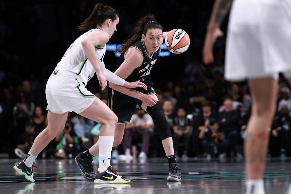 Breanna Stewart of the New York Liberty drives past Bridget Carleton of the Minnesota Lynx during the third quarter of Game 2 of the WNBA Finals at Barclays Center on October 13, 2024.