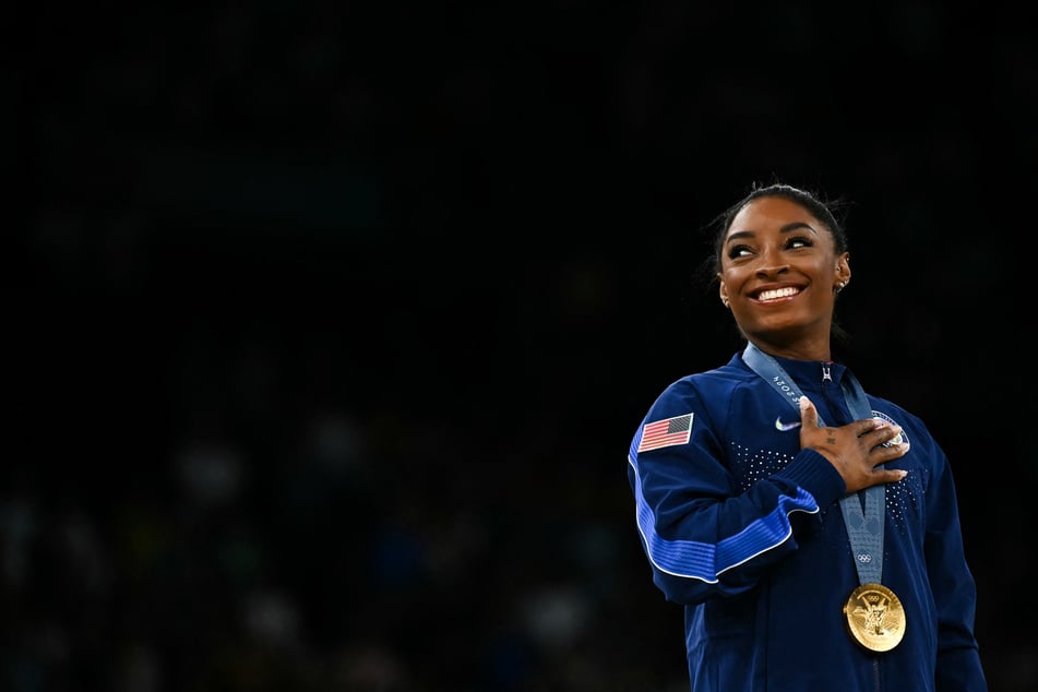 US Gold medallist Simone Biles celebrates during the podium ceremony for the artistic gymnastics women's vault during the Paris 2024 Olympic Games at the Bercy Arena in Paris, on Saturday.