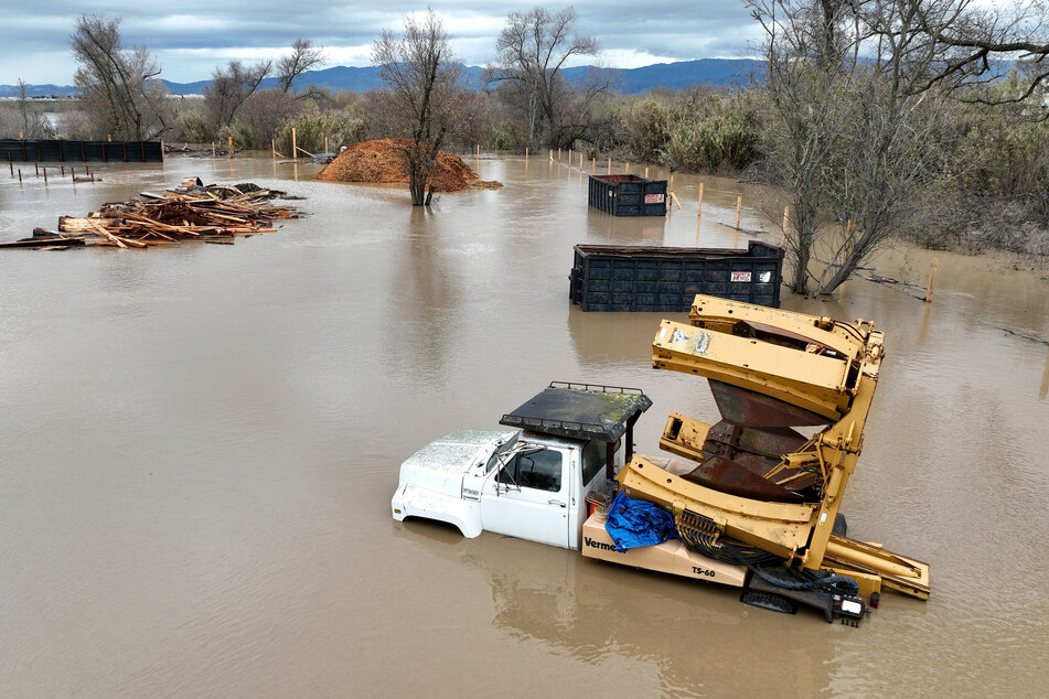 Farming equipment submerged in floodwater after the Salinas River overflowed on January 13, 2023 in Salinas, California.