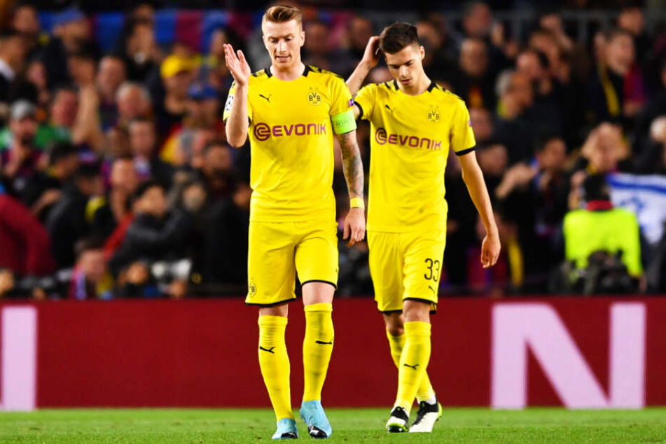 BVB-Kapitän Marco Reus (l.) schimpft nach dem ersten Gegentor vor sich hin.