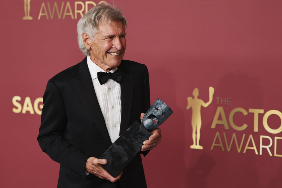 Harrison Ford poses with the Life Achievement award during the Actor Awards in Los Angeles, California, on March 1, 2026.