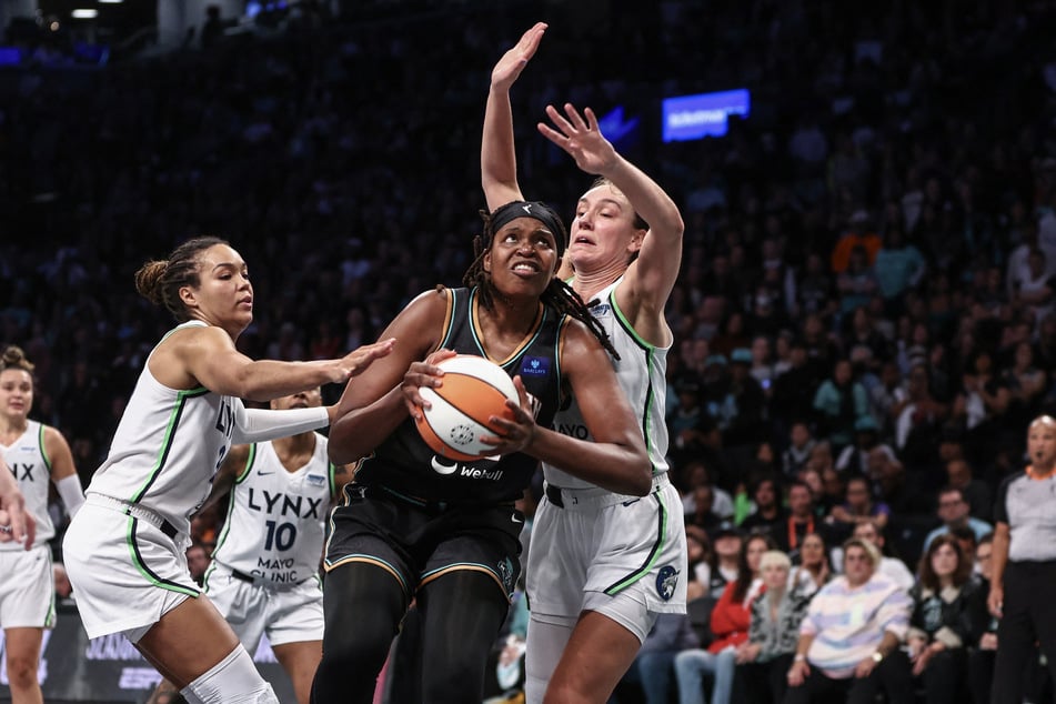 Jonquel Jones (c.), who led the New York Liberty's scoring with 17 points, was named the WNBA Finals MVP.