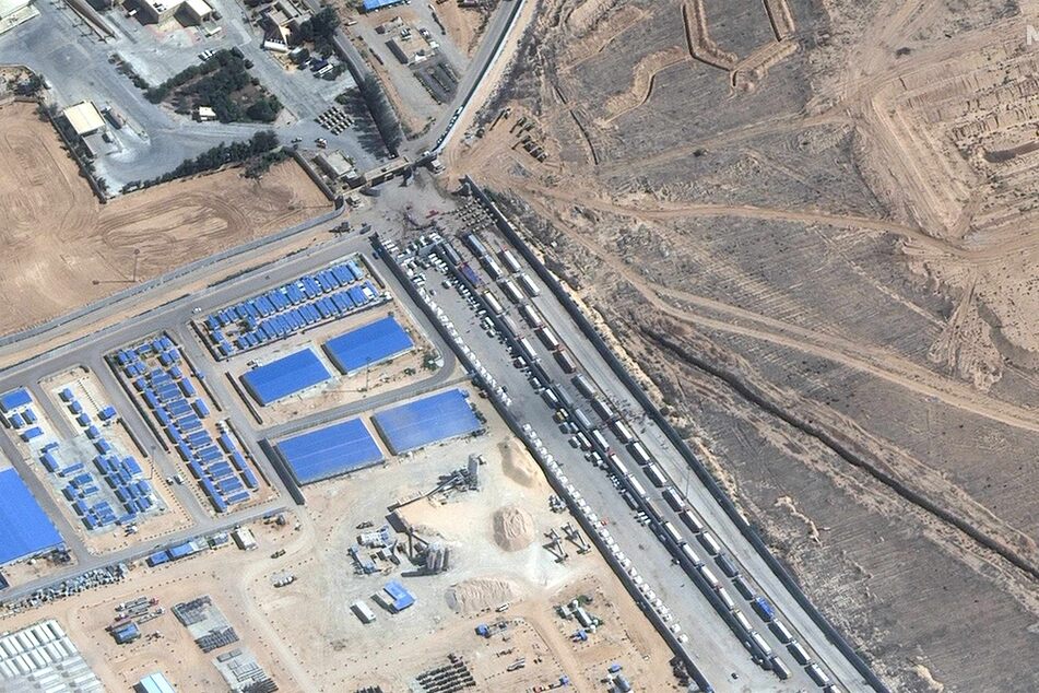 A view from above of aid trucks waiting on the Egyptian side of Rafah border crossing on Friday to bring supplies to Gaza.